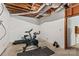 Unfinished basement featuring a treadmill, stationary bike, and exposed ceiling ductwork at 2281 Old Salisbury Concord Rd, Concord, NC 28025