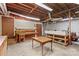 Unfinished basement area featuring work benches, shelving, and exposed ductwork at 2281 Old Salisbury Concord Rd, Concord, NC 28025