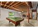 Spacious basement area with a fireplace, pool table, and glass door to the outside at 2281 Old Salisbury Concord Rd, Concord, NC 28025