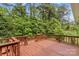 Wooden deck overlooking lush green trees and foliage in a private backyard setting at 2281 Old Salisbury Concord Rd, Concord, NC 28025