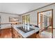 Kitchen island features a cooktop and breakfast bar seating and leads into the dining room at 2281 Old Salisbury Concord Rd, Concord, NC 28025
