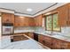 Gourmet kitchen offers wooden cabinets, modern countertops, and tile backsplash at 2281 Old Salisbury Concord Rd, Concord, NC 28025