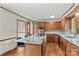 Spacious kitchen offers an island with cooktop, wooden cabinets and modern countertops at 2281 Old Salisbury Concord Rd, Concord, NC 28025