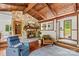 Warm living room featuring a stone fireplace, wood-beamed ceiling, and comfortable seating at 2281 Old Salisbury Concord Rd, Concord, NC 28025