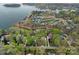 Aerial view of lakefront homes with mature trees at 276 Greyfriars Rd, Mooresville, NC 28117
