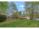 Picturesque backyard with a charming gazebo and lush green lawn, perfect for relaxing and entertaining near the waterfront at 276 Greyfriars Rd, Mooresville, NC 28117