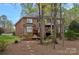 Stunning backyard featuring a spacious deck and beautiful landscaping, perfect for outdoor entertaining and relaxation at 276 Greyfriars Rd, Mooresville, NC 28117