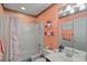 Cozy bathroom with tub and shower combo, decorative border, and floral accents at 276 Greyfriars Rd, Mooresville, NC 28117