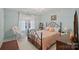 Charming bedroom with iron bed frame, rocking chair and a delightful window view at 276 Greyfriars Rd, Mooresville, NC 28117