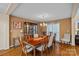 Elegant dining room with hardwood floors, large table, and a china cabinet, perfect for entertaining at 276 Greyfriars Rd, Mooresville, NC 28117