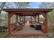 Relax in this cozy gazebo, complete with comfortable seating and scenic lake views at 276 Greyfriars Rd, Mooresville, NC 28117
