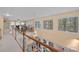 Hallway with a view to an office and tall windows overlooking natural views at 276 Greyfriars Rd, Mooresville, NC 28117