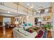 Spacious living room with high ceilings, hardwood floors, and a view to the dining area at 276 Greyfriars Rd, Mooresville, NC 28117