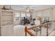 Bright home office featuring a ceiling fan, large windows, and neutral color palette at 276 Greyfriars Rd, Mooresville, NC 28117