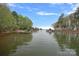 Scenic waterfront view showcasing multiple docks and serene water, perfect for boating and enjoying lake living at 276 Greyfriars Rd, Mooresville, NC 28117