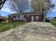 Charming single-story brick home with a spacious driveway and inviting front porch at 3025 School St, Claremont, NC 28610