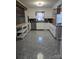 Open-concept kitchen featuring white cabinets, modern appliances, and updated countertops at 3025 School St, Claremont, NC 28610
