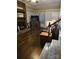 Warm living room area with a brick fireplace, wood floors, and comfortable seating at 3025 School St, Claremont, NC 28610