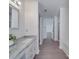 Bathroom with a vanity, double mirrors, and adjacent shower and tub at 3227 Deshler Morris Ln, Charlotte, NC 28216