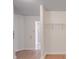 Bright bedroom with modern flooring, neutral walls, and a glimpse into the en-suite bathroom at 3227 Deshler Morris Ln, Charlotte, NC 28216
