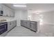Open concept kitchen features stainless appliances and granite countertops at 3227 Deshler Morris Ln, Charlotte, NC 28216