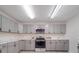 Updated kitchen with stainless steel appliances, marble counters, and ample storage at 3227 Deshler Morris Ln, Charlotte, NC 28216