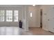 Bright living room features a half-wall, stylish flooring, and ample natural light from large windows at 3227 Deshler Morris Ln, Charlotte, NC 28216