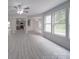 Open concept living room featuring modern flooring and neutral paint scheme at 3227 Deshler Morris Ln, Charlotte, NC 28216