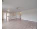 Open-concept living area featuring hardwood floors and a ceiling fan at 3227 Deshler Morris Ln, Charlotte, NC 28216