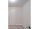 Image of a room featuring a door, light-colored walls, and wood-style flooring at 3227 Deshler Morris Ln, Charlotte, NC 28216