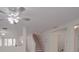 Open-concept staircase with a decorative ceiling fan connecting multiple levels of this gorgeous living space at 3227 Deshler Morris Ln, Charlotte, NC 28216
