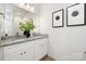 Modern bathroom with double vanity, granite countertop, and stylish fixtures at 327 Lincoln Sw St, Concord, NC 28025