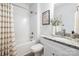 Bathroom featuring a shower-tub combo, granite countertop, and modern finishes at 327 Lincoln Sw St, Concord, NC 28025