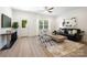 Living room featuring ample natural light, modern furnishings, and stylish decor at 327 Lincoln Sw St, Concord, NC 28025