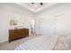 Relaxing main bedroom featuring neutral decor, soft lighting, and comfortable furnishings at 327 Lincoln Sw St, Concord, NC 28025
