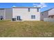 A spacious backyard features a patio, green grass and white siding at 3286 Shining Rock Sw St, Concord, NC 28027