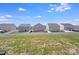 Backyards of several homes with white fences and grassy areas at 3286 Shining Rock Sw St, Concord, NC 28027
