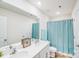 Well-lit bathroom with a double sink vanity and refreshing turquoise accents at 3286 Shining Rock Sw St, Concord, NC 28027