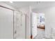 Bright bathroom featuring a glass shower and an open view to the bedroom at 3286 Shining Rock Sw St, Concord, NC 28027