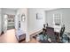 Elegant dining room entrance featuring a dining table set for six, complemented by modern decor and natural light at 3286 Shining Rock Sw St, Concord, NC 28027