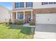 Charming two-story home with a covered porch, well-manicured lawn, and convenient two-car garage at 3286 Shining Rock Sw St, Concord, NC 28027