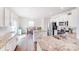 A bright, modern kitchen with white cabinetry, granite countertops, and stainless steel appliances at 3286 Shining Rock Sw St, Concord, NC 28027