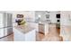 A stylish kitchen with granite countertops and stainless steel appliances, open to the living area at 3286 Shining Rock Sw St, Concord, NC 28027