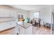 Bright eat-in kitchen with granite countertops, stainless steel appliances, and a breakfast nook at 3286 Shining Rock Sw St, Concord, NC 28027