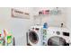 Well-organized laundry room features a washer, dryer, shelving, and laundry sorting station at 3286 Shining Rock Sw St, Concord, NC 28027