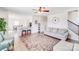 Bright living room with hardwood floors and an open view of the dining and kitchen areas at 3286 Shining Rock Sw St, Concord, NC 28027