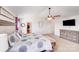 Bright main bedroom with carpet, a ceiling fan, ensuite bathroom, and walk-in closet at 3286 Shining Rock Sw St, Concord, NC 28027