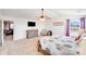 Large main bedroom featuring a flatscreen TV, carpeted floors, and a ceiling fan at 3286 Shining Rock Sw St, Concord, NC 28027