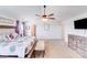 Comfortable main bedroom featuring a ceiling fan, flatscreen TV, dresser, and carpeted floors at 3286 Shining Rock Sw St, Concord, NC 28027