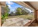 Concrete patio area with brick railing and mature trees in the backyard at 3320 28Th Ne St, Hickory, NC 28601